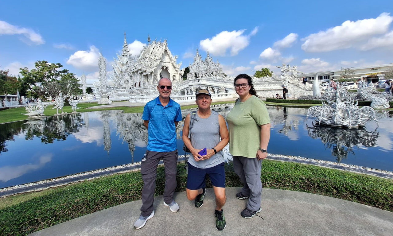Customers at the iconic White Temple (Wat Rong Khun) in Chiang Rai for 21-Day Southeast Asia Adventure Tour
